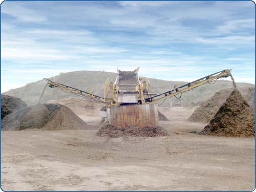 The product that is put into this machine is from the tub grinders (see previous slide). From here, it is separated by material size. The piles are then moved to another location in the green waste facility and are moistened and rotated to promote quick decomposition.