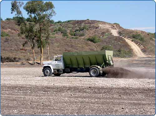 This is the last step of the recycling process. The process started with green waste that was unusable to the public, delivered to a green waste facility, processed, and then delivered to a farmer (in this case). You may also see trucks spreading this material over your local parks. This keeps the ground fresh with important nutrients and provides a healthy, natural environment for us to enjoy.  There are many other products that are produced by green waste facilities and you can find more information onlin